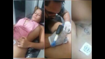 Cute chubby girl having tattoo on pussy